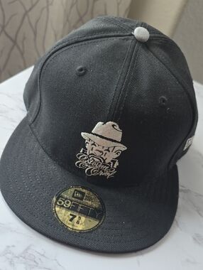 New Era Black Cap with Ivory Embroidered Character